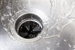water-swirling-down-a-sink-with-garbage-disposal