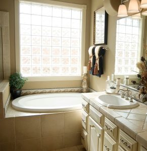 large-bathtub-with-decorative-tile-surround