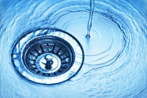 clean-water-swirling-down-a-sink-drain