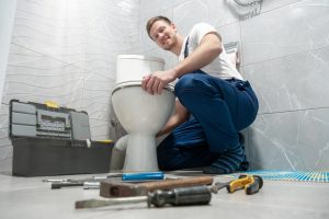 plumber-fixing-a-toilet