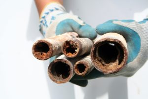 end-view-of-pipes-with-badly-rusted-interiors